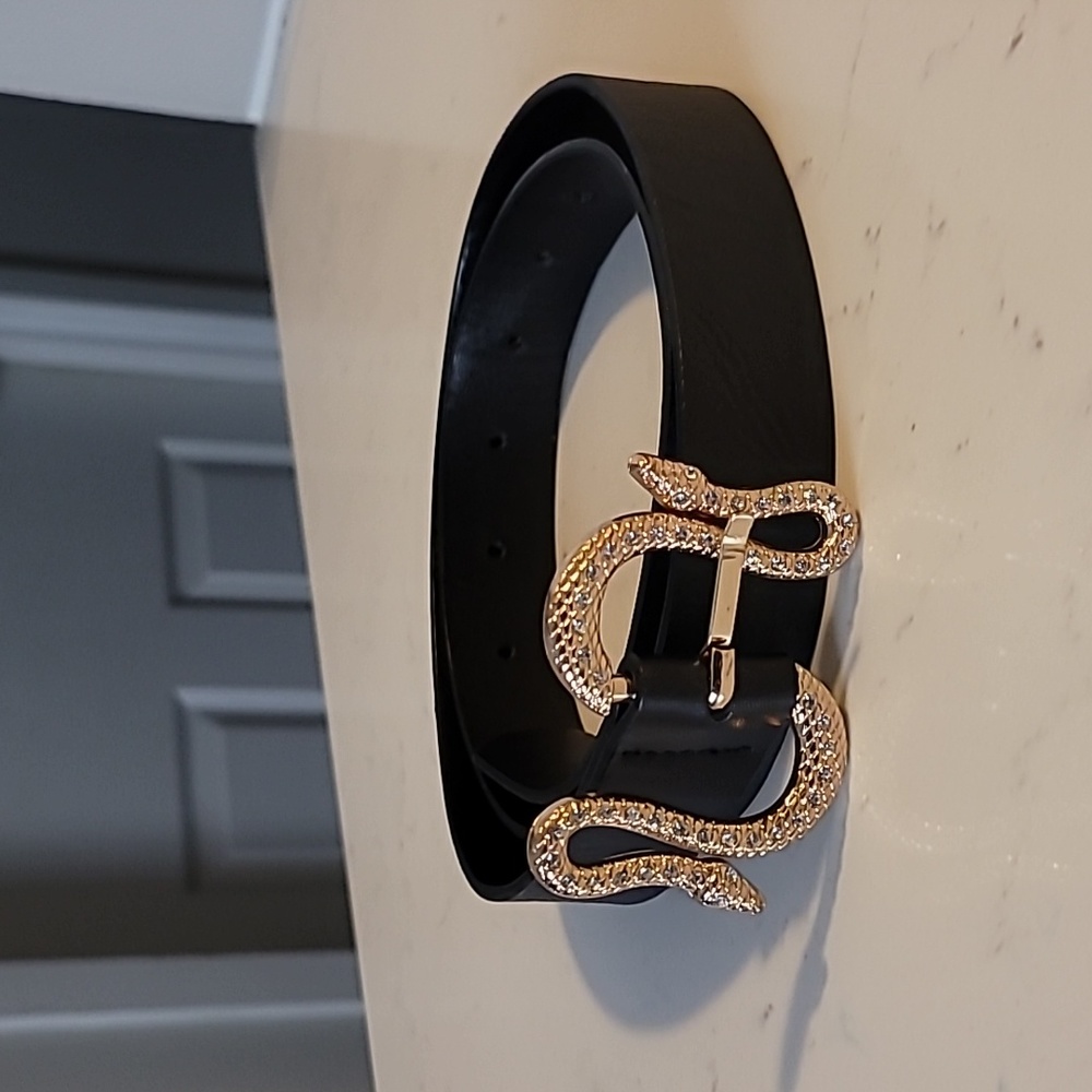 Rhinestone embellished gold snake buckle black belt